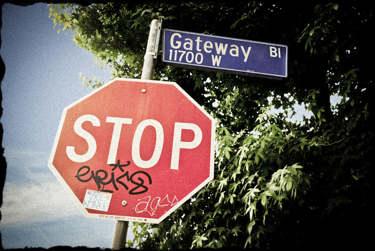 Stop sign with graffiti on it.